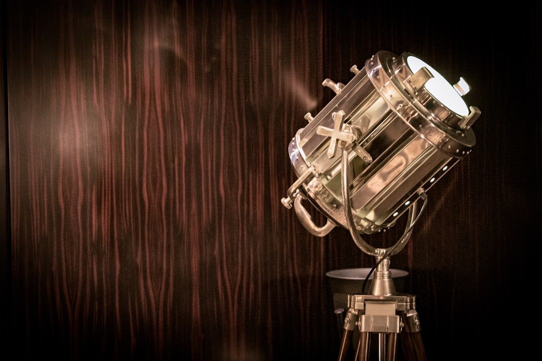 Vintage television studio set with bright stage lights and old broadcast cameras